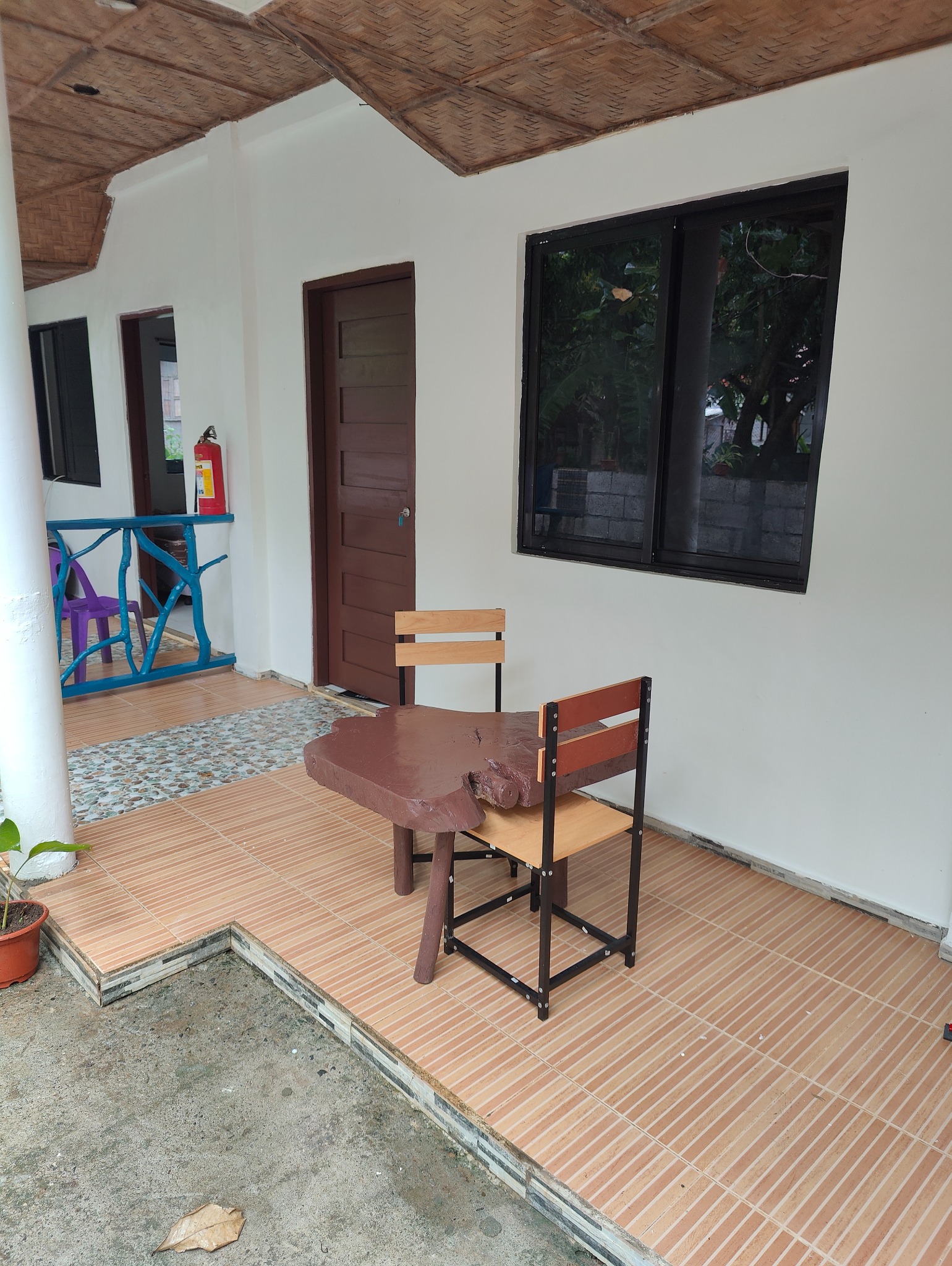 Small table and chairs on the room veranda