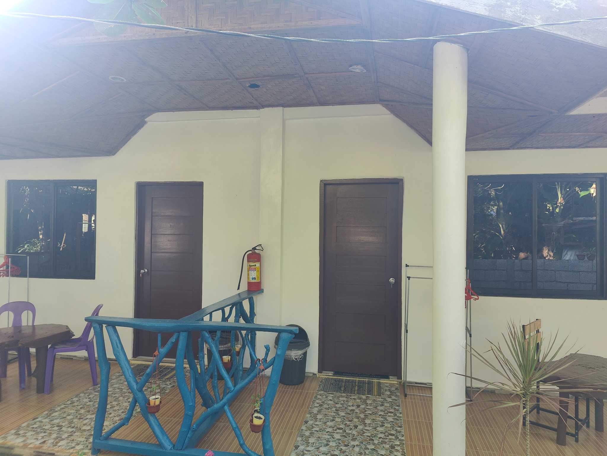 Covered veranda and entrance to the guest rooms
