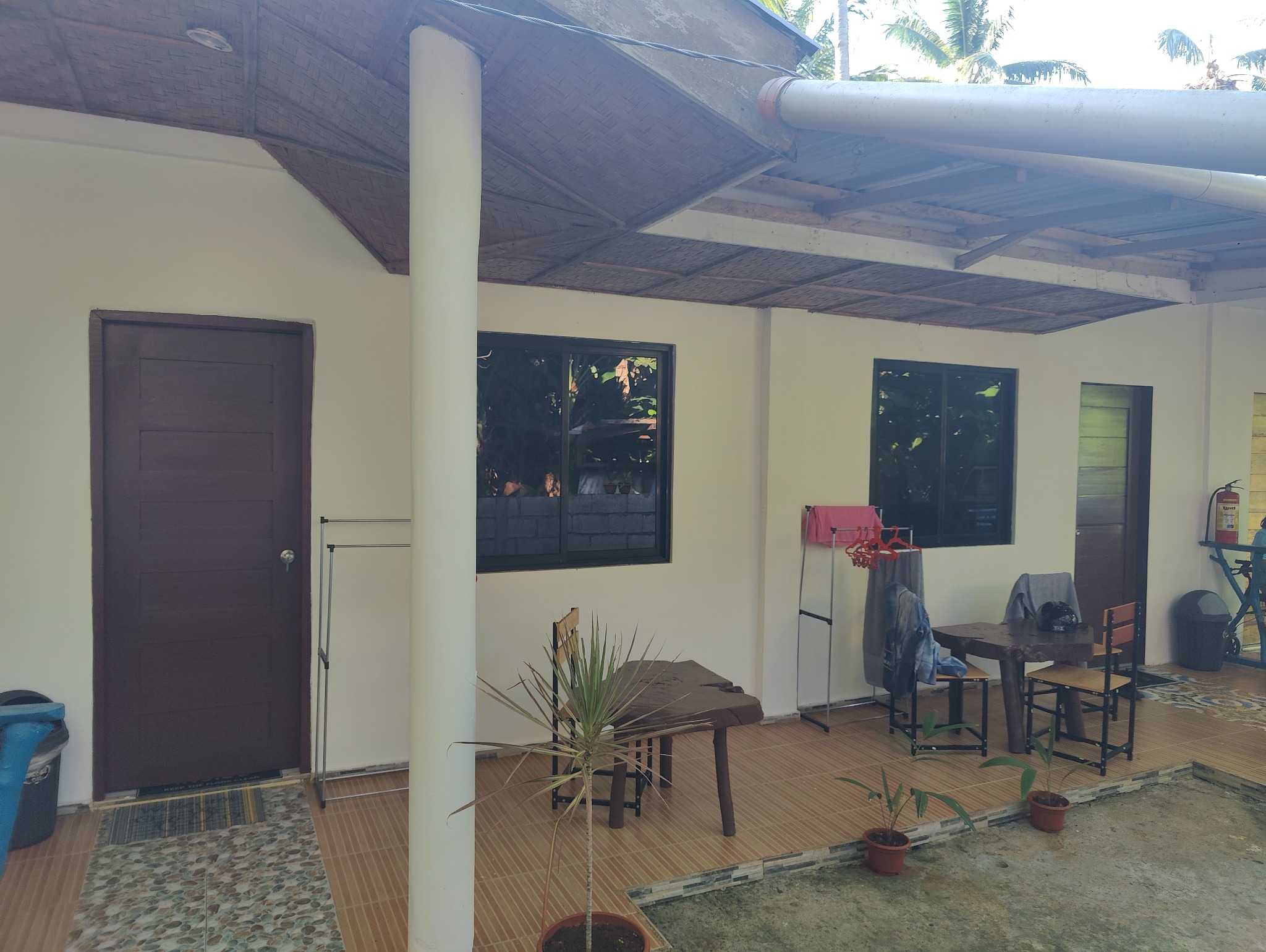 Outdoor veranda with tables and chairs